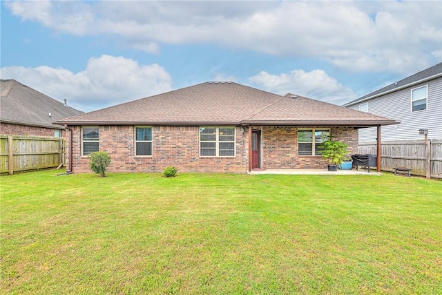 811 SW Pure Globe St, Bentonville, AR 72712 - back of house featuring brick siding, a patio, and a shingled roof