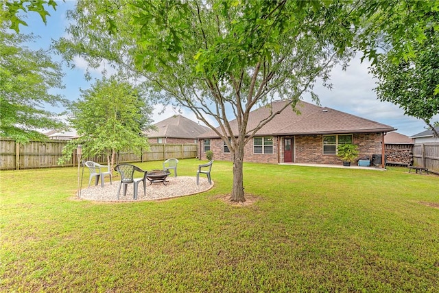 811 SW Pure Globe St, Bentonville, AR 72712 - view of yard featuring an outdoor fire pit and a patio