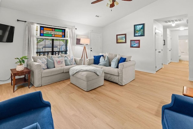 1110 Meadowlark Ln, Siloam Springs, AR 72761 - living room with vaulted ceiling, a ceiling fan, light wood-type flooring, and baseboards