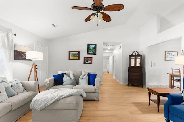 1110 Meadowlark Ln, Siloam Springs, AR 72761 - living area featuring a ceiling fan, light wood-type flooring, vaulted ceiling, and baseboards