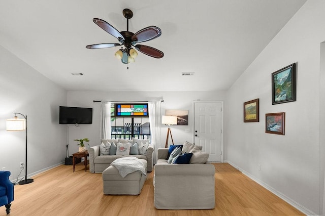 1110 Meadowlark Ln, Siloam Springs, AR 72761 - living area with light wood finished floors, ceiling fan, and baseboards