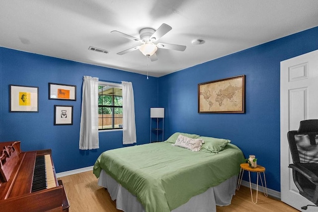 1110 Meadowlark Ln, Siloam Springs, AR 72761 - bedroom featuring wood finished floors, baseboards, and ceiling fan