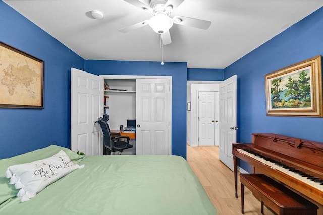 1110 Meadowlark Ln, Siloam Springs, AR 72761 - bedroom with light wood-style flooring, a closet, and a ceiling fan
