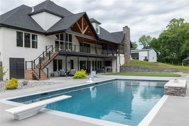 2762 Wilson Ln, Fayetteville, AR 72703 - rear view of house featuring stairs, a patio area, an outdoor pool, and a wooden deck