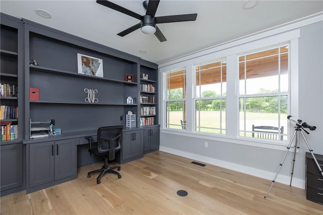 2762 Wilson Ln, Fayetteville, AR 72703 - home office featuring baseboards, ceiling fan, and light wood-style floors