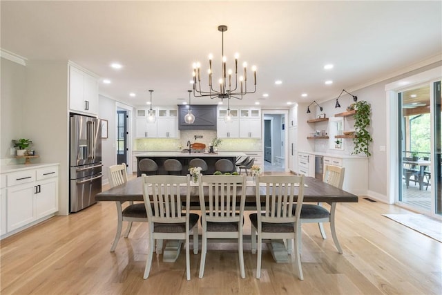 2762 Wilson Ln, Fayetteville, AR 72703 - dining space with a chandelier, light wood-style flooring, recessed lighting, ornamental molding, and baseboards