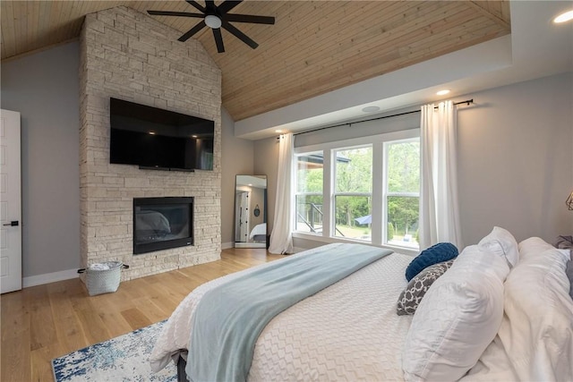 2762 Wilson Ln, Fayetteville, AR 72703 - bedroom featuring wooden ceiling, a stone fireplace, wood finished floors, high vaulted ceiling, and baseboards
