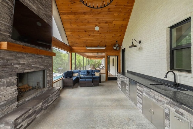 2762 Wilson Ln, Fayetteville, AR 72703 - view of patio / terrace with a sink, exterior kitchen, and an outdoor living space with a fireplace