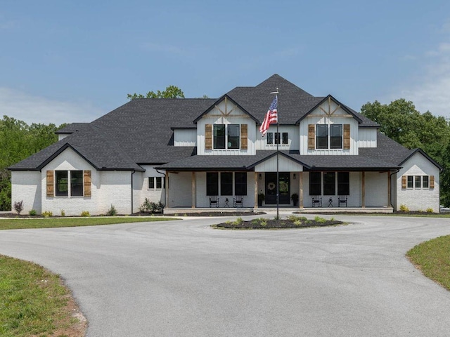 2762 Wilson Ln, Fayetteville, AR 72703 - view of front facade featuring covered porch and roof with shingles