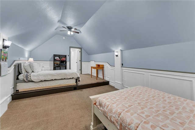 12292 Butler Rd, Prairie Grove, AR 72753 - bedroom with vaulted ceiling, carpet, a wainscoted wall, a ceiling fan, and a decorative wall