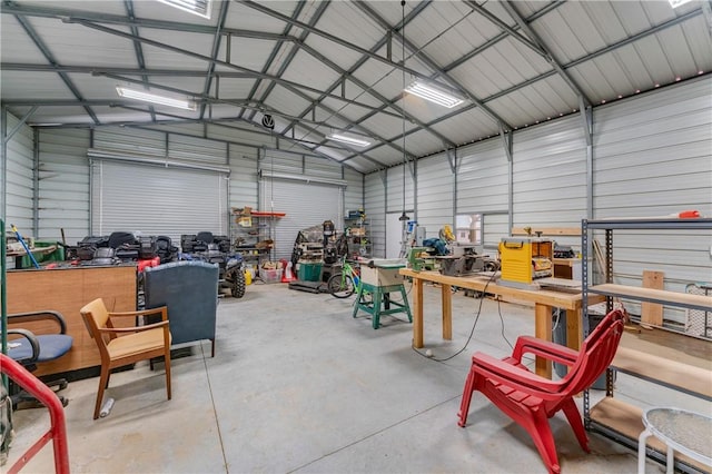 12292 Butler Rd, Prairie Grove, AR 72753 - garage featuring metal wall and a workshop area