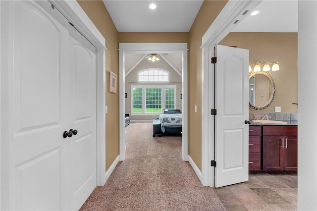 12292 Butler Rd, Prairie Grove, AR 72753 - corridor with a sink, baseboards, light colored carpet, and recessed lighting