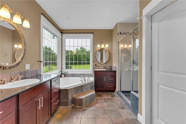 12292 Butler Rd, Prairie Grove, AR 72753 - bathroom with healthy amount of natural light, two vanities, a shower stall, and a bath