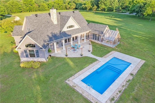 12292 Butler Rd, Prairie Grove, AR 72753 - outdoor pool with a patio, a lawn, and a forest view
