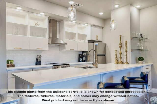 3329 Mp Pkwy Unit 308, Bentonville, AR 72712 - kitchen featuring wall chimney exhaust hood, freestanding refrigerator, white cabinetry, a breakfast bar area, and tasteful backsplash