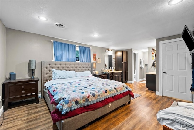 14090 Canal St, Rogers, AR 72758 - bedroom with wood finished floors, baseboards, and recessed lighting