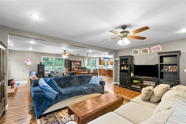 14090 Canal St, Rogers, AR 72758 - living area with a ceiling fan, wood finished floors, recessed lighting, and healthy amount of natural light