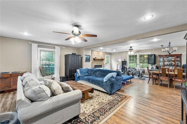 14090 Canal St, Rogers, AR 72758 - living room with ceiling fan, wood finished floors, a fireplace, and recessed lighting