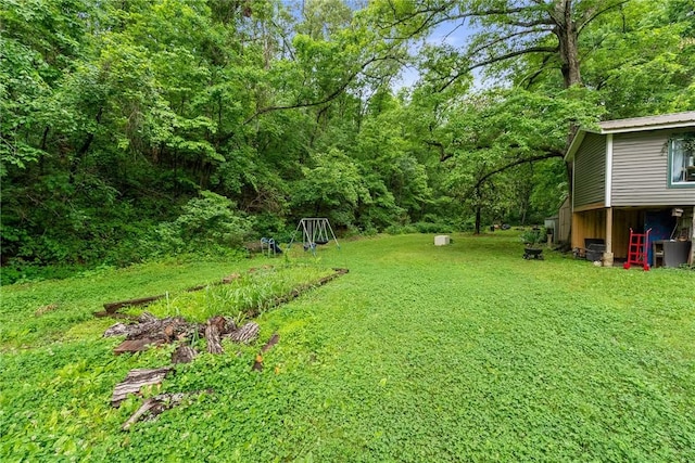 14090 Canal St, Rogers, AR 72758 - view of grassy yard featuring a wooded view