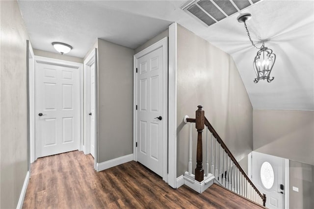 14090 Canal St, Rogers, AR 72758 - corridor with an upstairs landing, wood finished floors, baseboards, and a chandelier