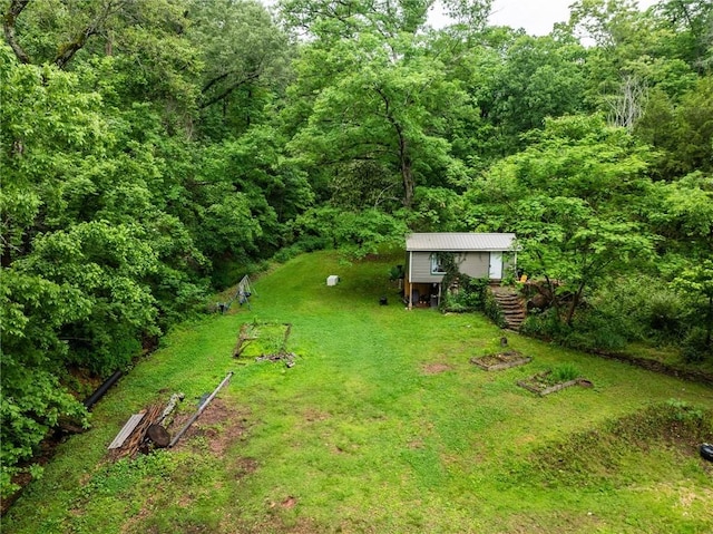 14090 Canal St, Rogers, AR 72758 - view of grassy yard featuring a wooded view