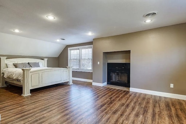 14090 Canal St, Rogers, AR 72758 - bedroom featuring baseboards, dark wood finished floors, vaulted ceiling, recessed lighting, and a fireplace