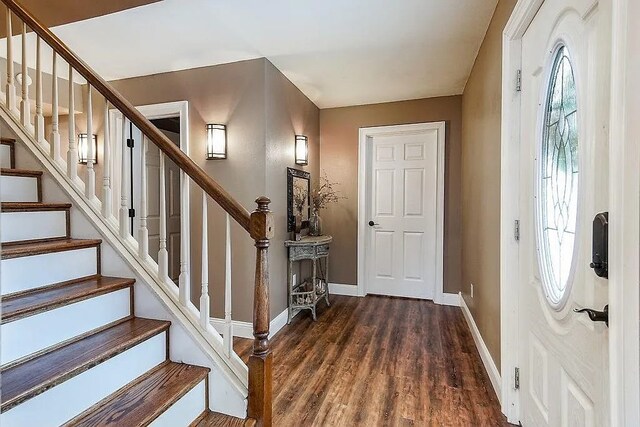 14090 Canal St, Rogers, AR 72758 - foyer entrance with wood finished floors, baseboards, and stairway