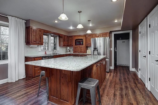 14090 Canal St, Rogers, AR 72758 - kitchen featuring stainless steel refrigerator with ice dispenser, dark wood-style flooring, baseboards, a kitchen bar, and recessed lighting