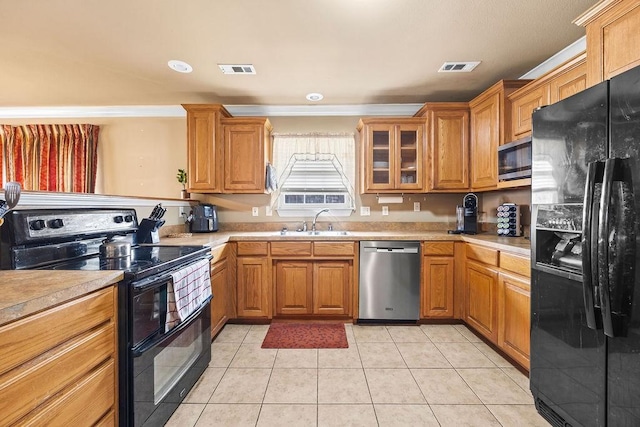 809 Irelan, Lowell, AR 72745 - kitchen with black appliances, a sink, and light countertops