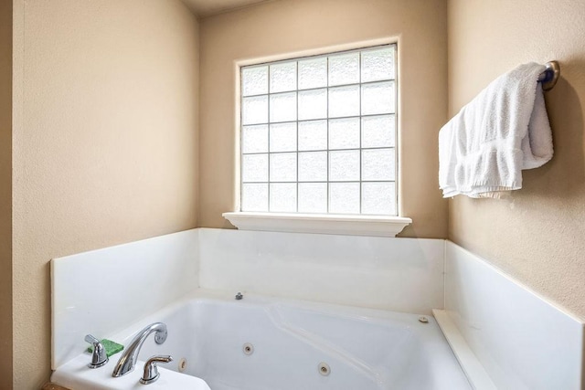 809 Irelan, Lowell, AR 72745 - full bath featuring healthy amount of natural light and a jetted tub