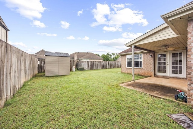 809 Irelan, Lowell, AR 72745 - view of yard featuring ceiling fan, french doors, and a patio area