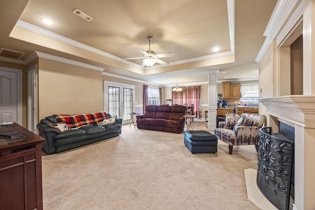 809 Irelan, Lowell, AR 72745 - living area with a tray ceiling, light carpet, ornamental molding, ornate columns, and a ceiling fan