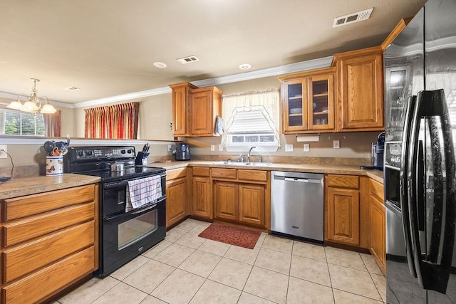 809 Irelan, Lowell, AR 72745 - kitchen featuring black appliances, a sink, ornamental molding, a chandelier, and plenty of natural light