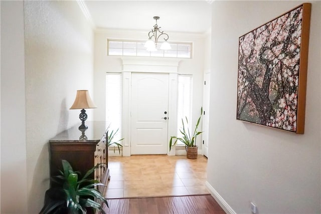 1011 Harvest St, Centerton, AR 72719 - foyer featuring light tile patterned floors and crown molding