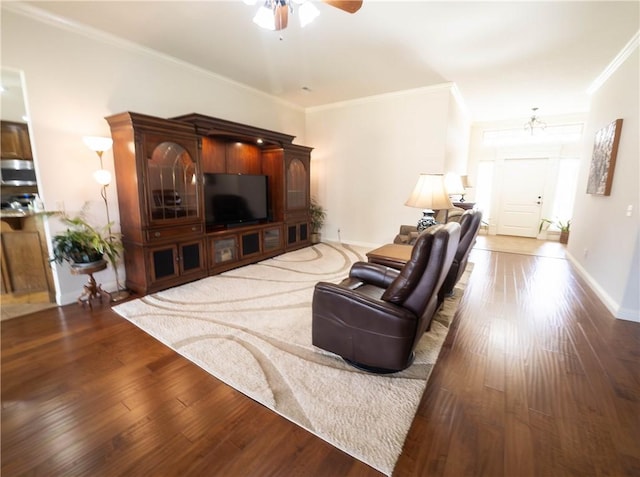 1011 Harvest St, Centerton, AR 72719 - living area featuring a ceiling fan, wood finished floors, and ornamental molding