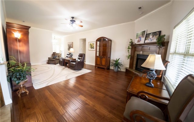 1011 Harvest St, Centerton, AR 72719 - living room with ceiling fan, a tile fireplace, wood finished floors, and crown molding