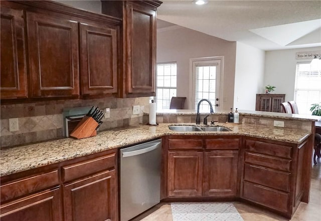 1011 Harvest St, Centerton, AR 72719 - kitchen with stainless steel dishwasher, a peninsula, light stone countertops, and decorative backsplash
