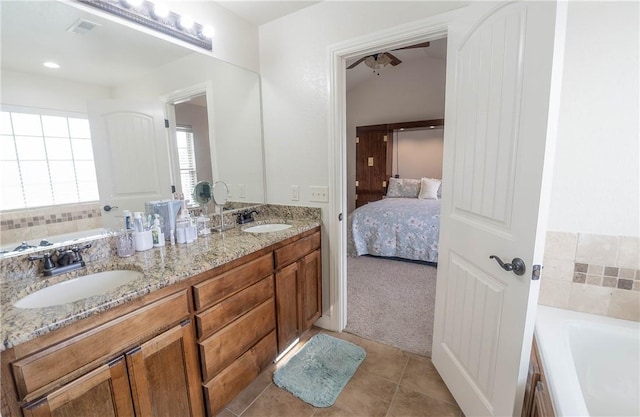 1011 Harvest St, Centerton, AR 72719 - bathroom featuring double vanity, a bath, tile patterned flooring, and ensuite bath
