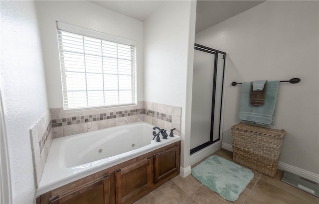 1011 Harvest St, Centerton, AR 72719 - full bathroom featuring a stall shower, a whirlpool tub, and tile patterned flooring