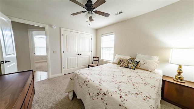 1011 Harvest St, Centerton, AR 72719 - carpeted bedroom featuring multiple windows, a closet, and ceiling fan