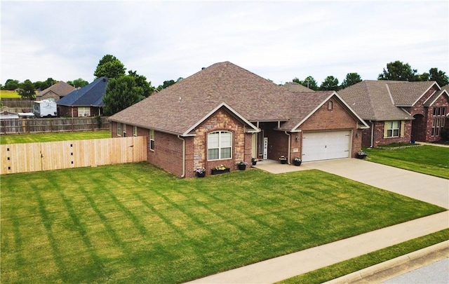 1011 Harvest St, Centerton, AR 72719 - view of front of house with concrete driveway, brick siding, a shingled roof, and an attached garage