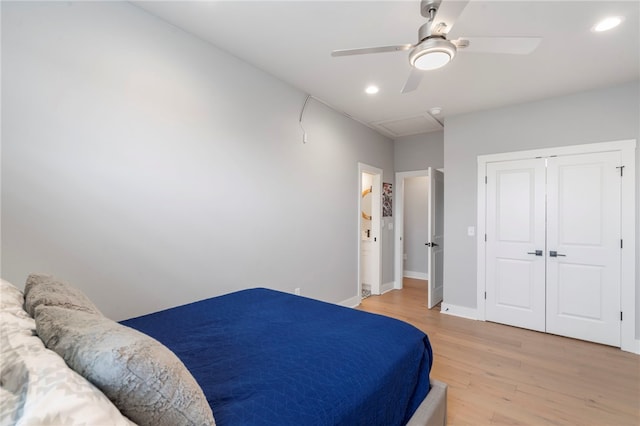 1408 SW Breeze Ct, Bentonville, AR 72713 - bedroom with light wood finished floors, recessed lighting, baseboards, ceiling fan, and a closet