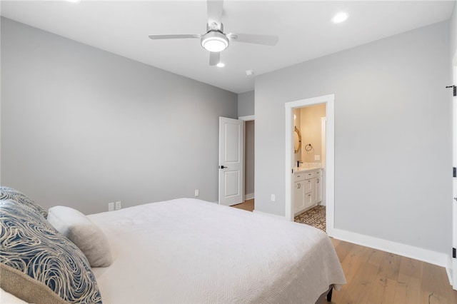 1408 SW Breeze Ct, Bentonville, AR 72713 - bedroom featuring recessed lighting, baseboards, light wood-style floors, ensuite bathroom, and ceiling fan
