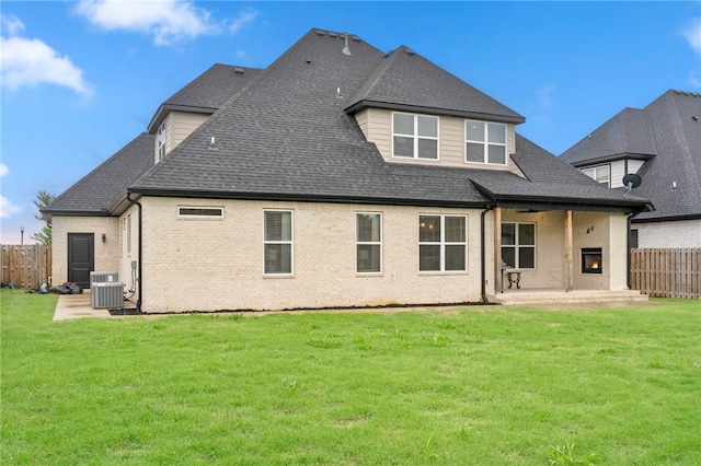 1408 SW Breeze Ct, Bentonville, AR 72713 - rear view of property featuring a patio, brick siding, roof with shingles, and central air condition unit