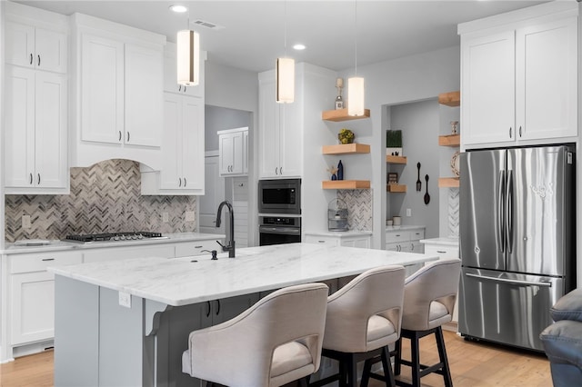 1408 SW Breeze Ct, Bentonville, AR 72713 - kitchen with appliances with stainless steel finishes, open shelves, a sink, white cabinets, and recessed lighting