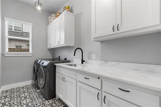 1408 SW Breeze Ct, Bentonville, AR 72713 - washroom featuring independent washer and dryer, cabinet space, and baseboards