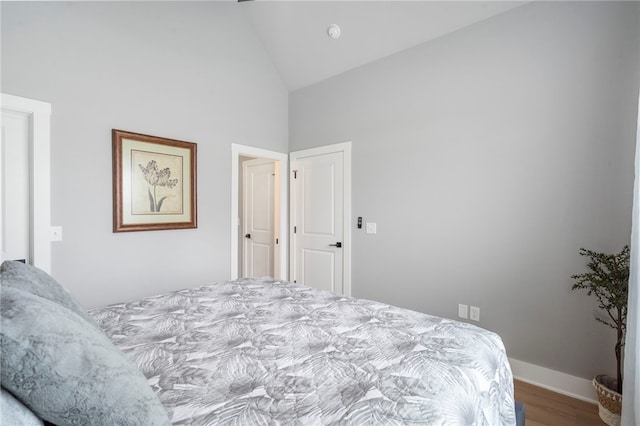 1408 SW Breeze Ct, Bentonville, AR 72713 - bedroom with high vaulted ceiling, wood finished floors, and baseboards