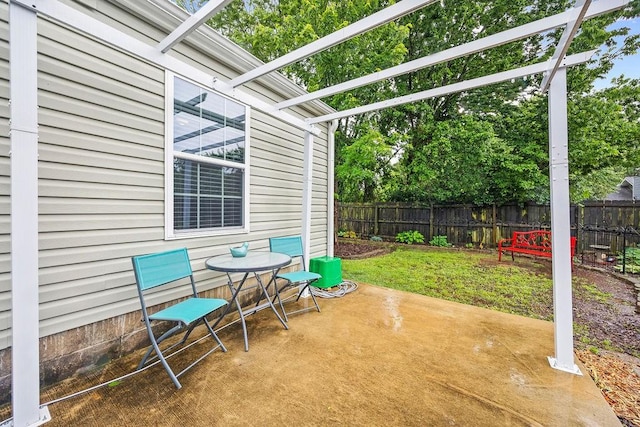 397 E Evergreen Ln, Fayetteville, AR 72703 - fenced backyard featuring a patio area and outdoor dining area