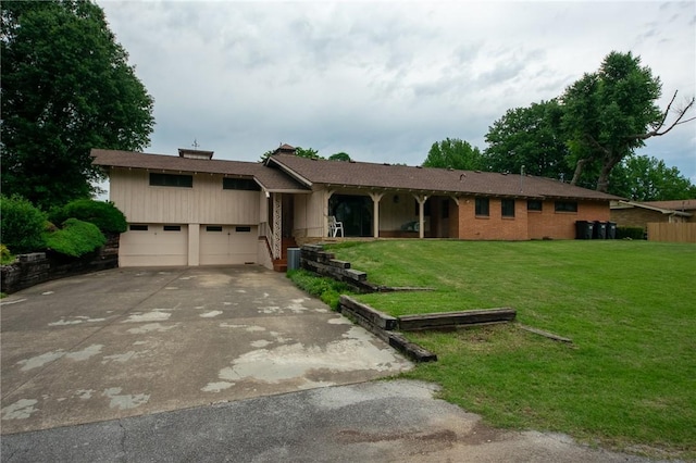 1617 Ranch Dr, Springdale, AR 72762 - single story home with a front lawn, concrete driveway, and a chimney