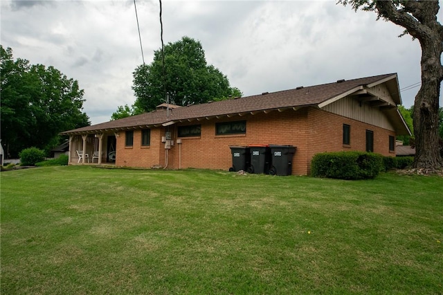 1617 Ranch Dr, Springdale, AR 72762 - rear view of house featuring brick siding, a yard, and board and batten siding